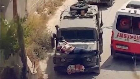 ¿Escudo humano?: Militares israelíes atan a un palestino herido a un vehículo 